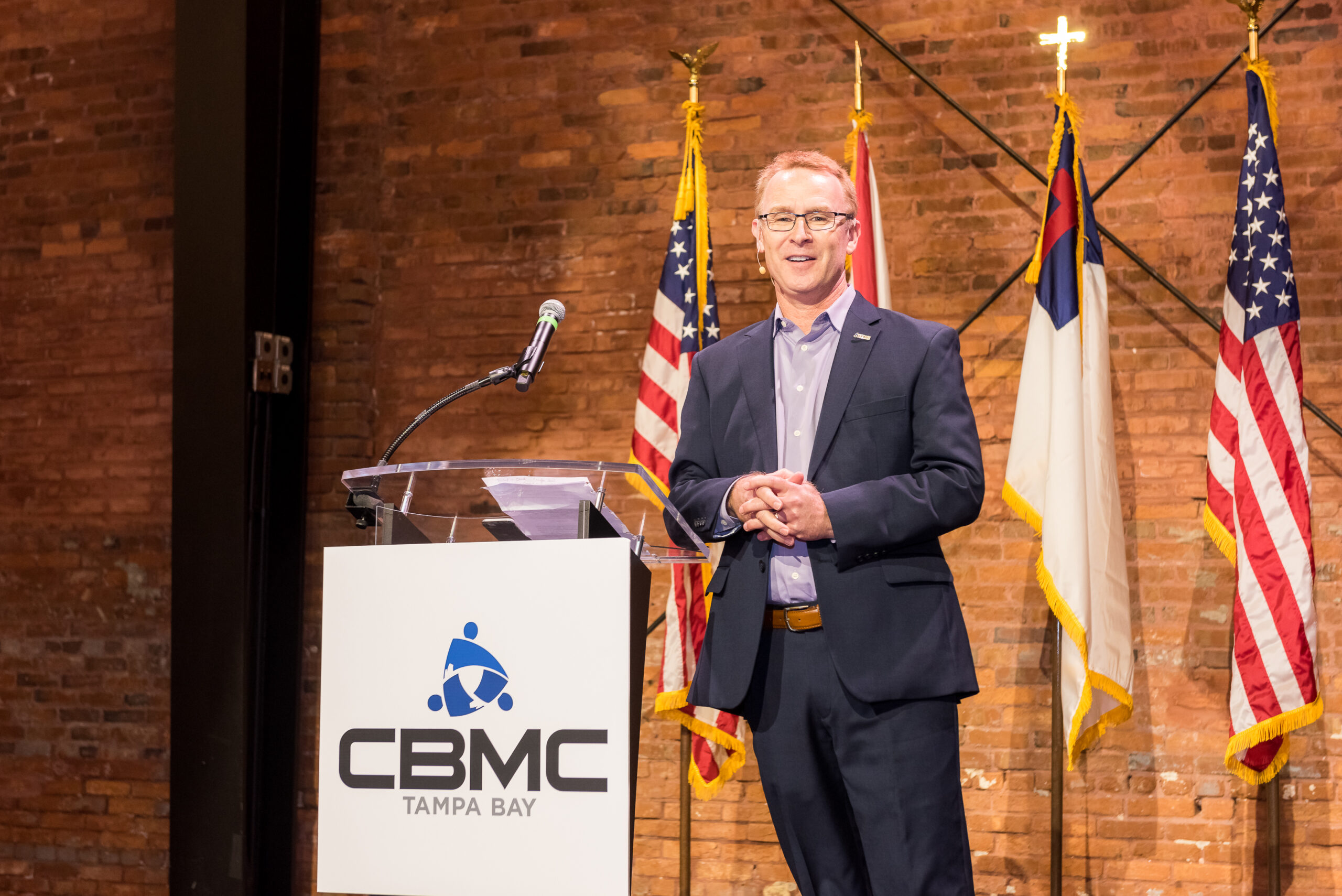 Todd Hopkins giving a speech from a podium